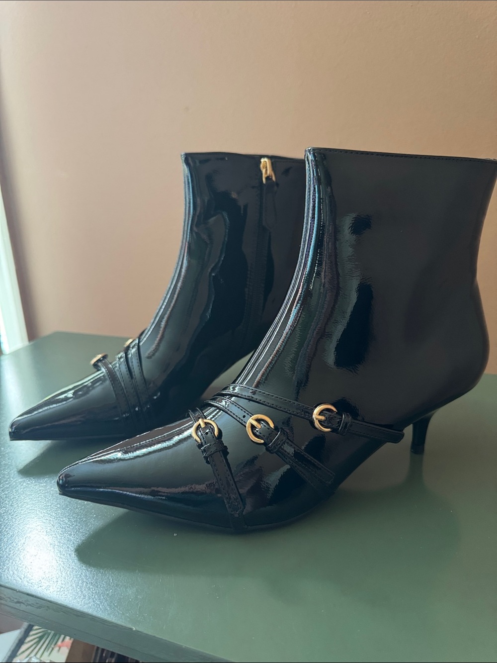 Patent-Style Black Pointed Ankle Booties with Gold Buckle Detail